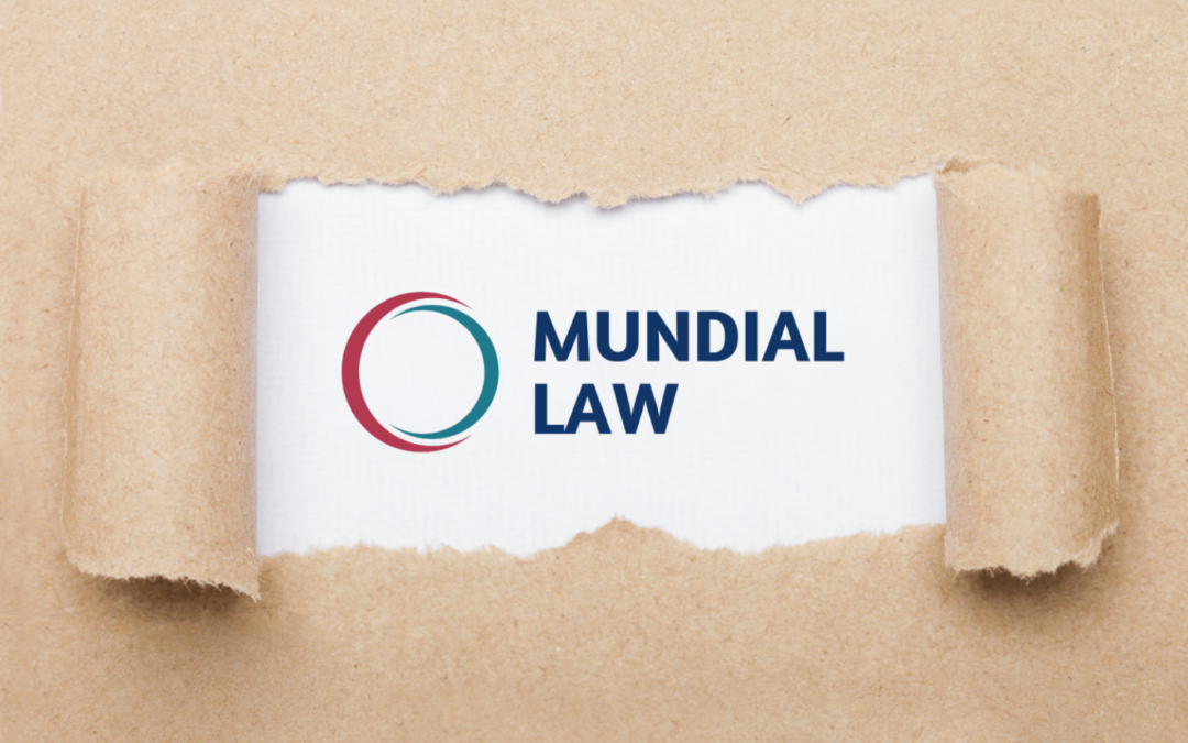 paper ripped open from the middle to reveal the Mundial Law logo